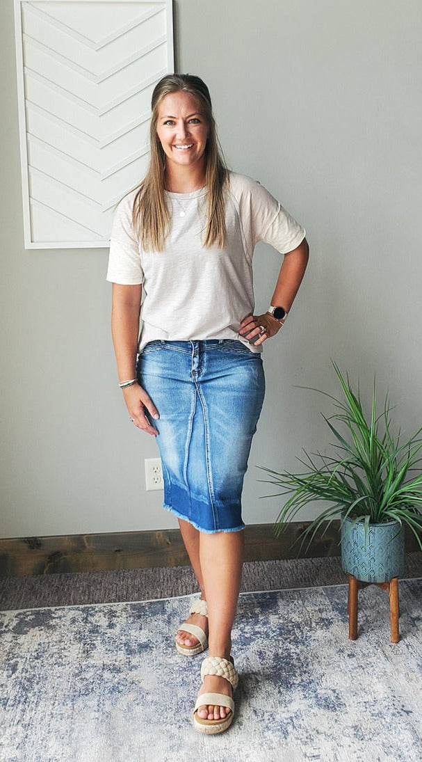The Taupe Colorblock Loose Fit Top is the perfect, easy choice for our neutral-loving moms on-the-go. With its neutral tones and simple, comfy style, it's the ideal top for work, school, or park dates. Stay comfortable and stylish all day long with this versatile piece. Classy Closet online modest boutique clothing for Christian moms and everyday casual outfits