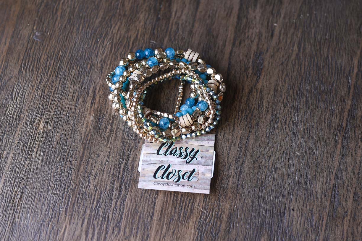 This adorable set of gold and teal elastic bracelets brings instant joy to any outfit! Wear them individually for a subtle touch or stack them all together for a bold boho statement. These versatile accessories effortlessly mix and match, adding a playful yet chic element to your everyday style. Perfect for brightening your look with minimal effort!