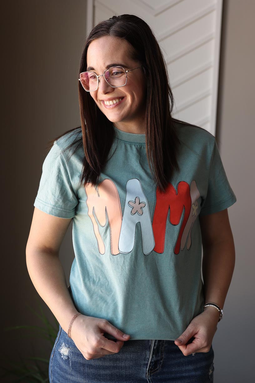 Feel comfortable and stylish in our Teal "Mama" Mineral Wash Tee. The fun graphic adds a touch of happiness to your everyday life. Versatile to layer or wear alone, this tee is a must-have for any busy mama. Classy Closet online women's boutique for modest fashion, hard to find denim skirts, and cute casual outfits. hull, iowa