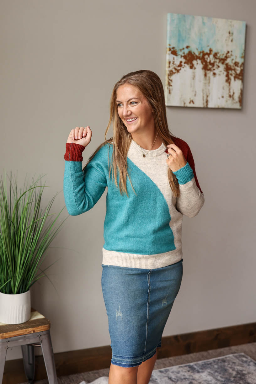 This teal colorblock sweater is the perfect way to liven up your cold weather attire. Classy Closet Online Boutique for Casual Mom Fashion in Iowa