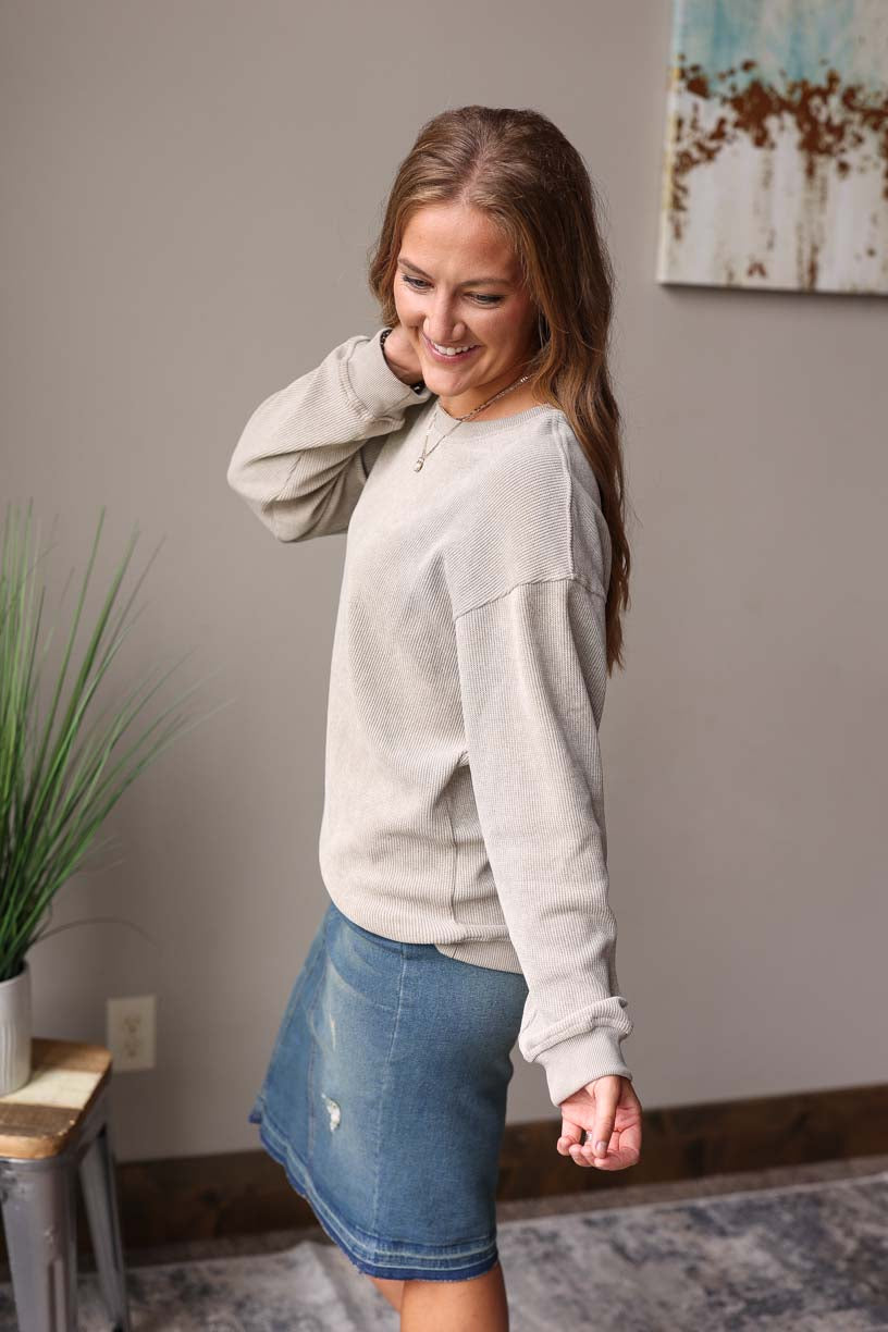Light Grey Olive Ribbed Sweatshirt features a slightly oversized fit for extra comfort. Made with a thermal waffle material, it provides a cozy and soft feel with an added touch of style. Classy Closet Women's Online Boutique for Modest Casual Outfits