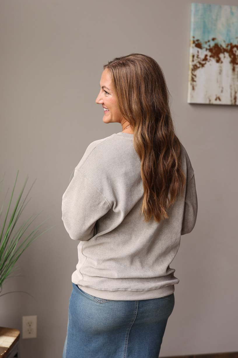 Light Grey Olive Ribbed Sweatshirt features a slightly oversized fit for extra comfort. Made with a thermal waffle material, it provides a cozy and soft feel with an added touch of style. Classy Closet Women's Online Boutique for Modest Casual Outfits