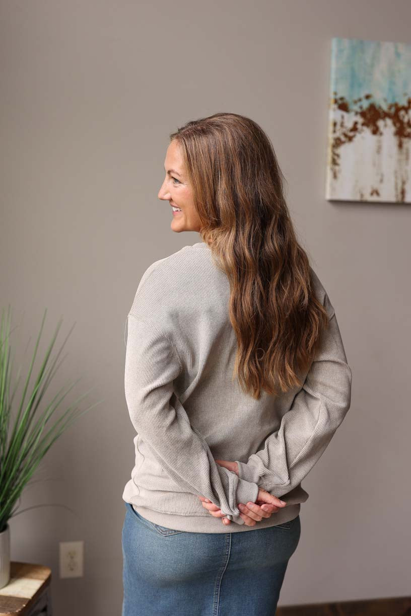 Light Grey Olive Ribbed Sweatshirt features a slightly oversized fit for extra comfort. Made with a thermal waffle material, it provides a cozy and soft feel with an added touch of style. Classy Closet Women's Online Boutique for Modest Casual Outfits