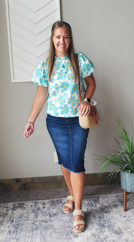 The Blue Floral Puff Sleeve Top is the perfect combination of cute and feminine. With its turquoise blue and white floral design and puff sleeves, it adds a touch of elegance to any outfit. Whether for work, a date night, or special events, this blouse effortlessly dresses up your look. Classy Closet Online Modest BOutique CLothing for Christian Moms