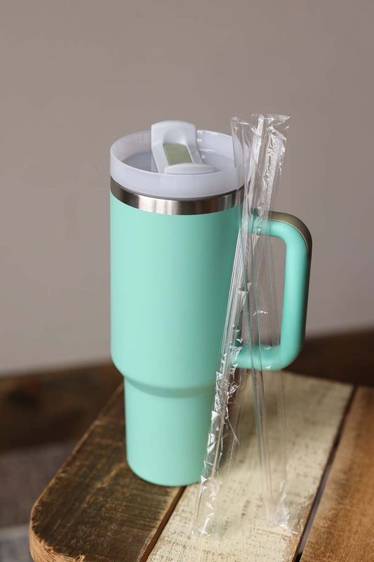 40 oz Turquoise Stainless Tumbler with handle and 2 straws. It features a twist top to drink with a either drink hole or with a straw.