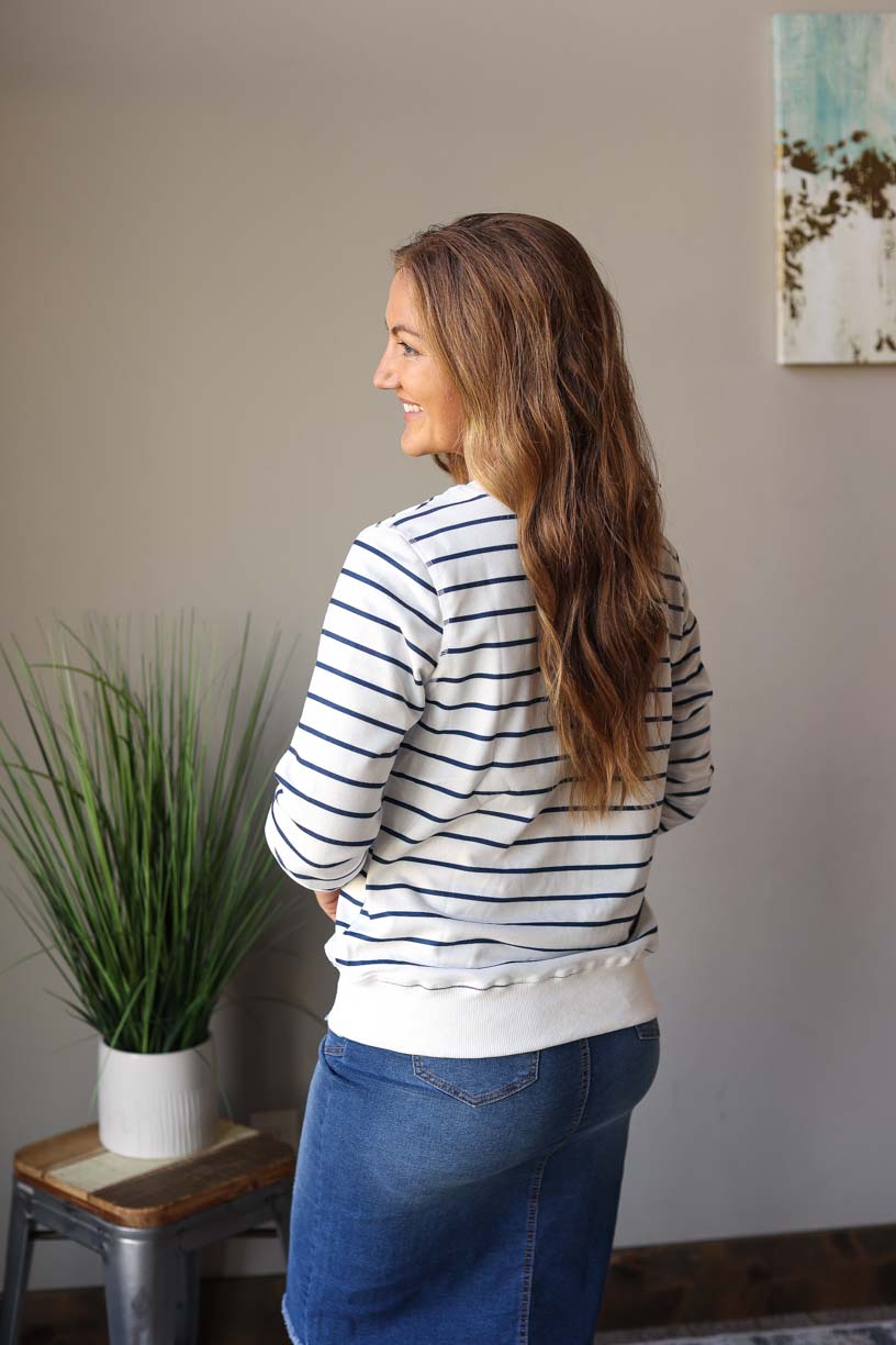 Stay cozy and cute in this classic navy and white stripe pullover that'll keep you snug and in style. Ribbed trim adds an extra touch of sweetness to this comfy top. Women's Online BOutique for Modest Fashion