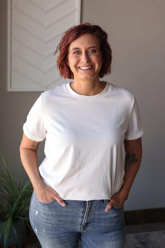 Update your summer style with our White Crewneck Tee. Versatile for any look, this tee is the perfect blend of relaxed and flattering fit. Dress it up or down, the options are endless! Say goodbye to ill-fitting or oversized basics and hello to effortless outfit styling. Classy Closet online women's clothing boutique for easy cute outfits, affordable tops, and hard to find denim skirts. Hull iowa
