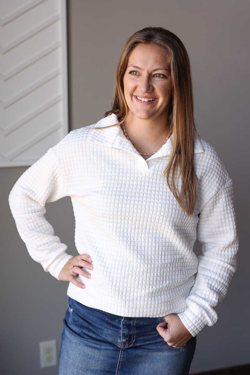 Elevate your everyday style with our White Quilted Textured Collared Top. This pullover sweatshirt features a v-neck and collar, adding a touch of sophistication to your comfort wear. Perfect for any occasion, from casual hangouts to work meetings, this crisp white top will be your new go-to. Classy Closet trendy, affordable women's cute tops for winter spring. A clothing boutique for hard to find skirts and modest fashion.