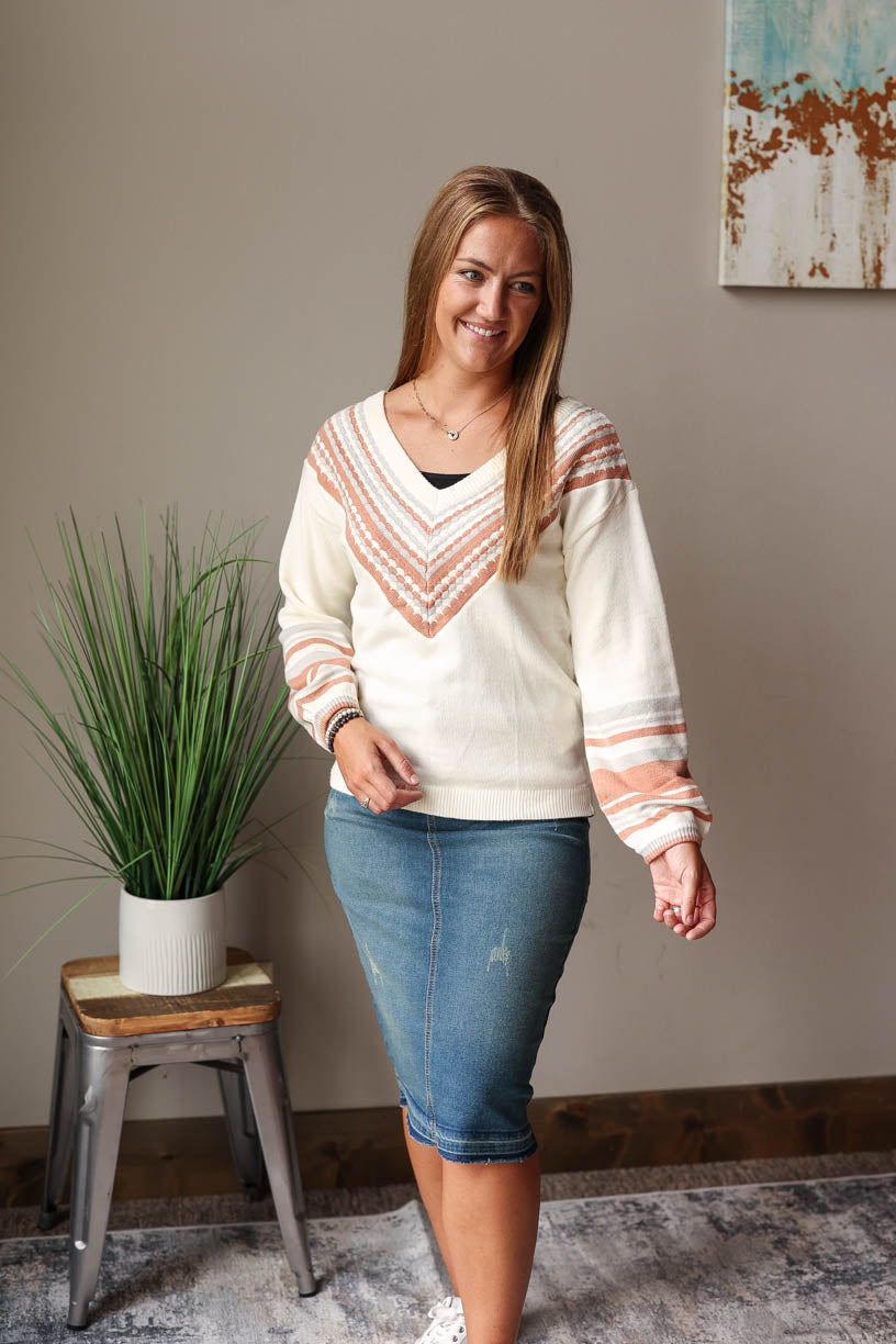 Stay cozy and chic in this beige V-Neck Contrast Sweater - perfect for the fall winter season! Featuring a subtle print detail and v-neck line, you'll love this chill yet stylish piece! Classy Closet Fall Fashion 