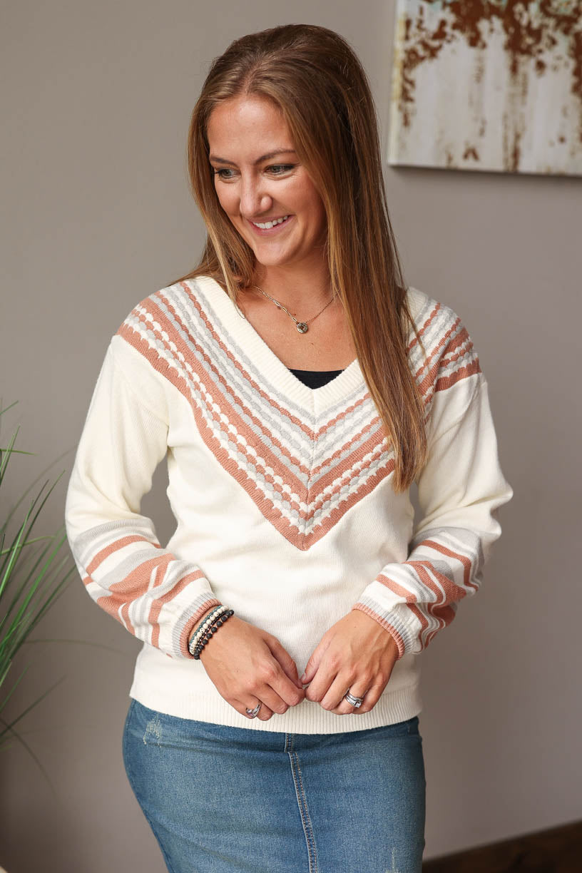 Stay cozy and chic in this beige V-Neck Contrast Sweater - perfect for the fall winter season! Featuring a subtle print detail and v-neck line, you'll love this chill yet stylish piece! Classy Closet Fall Fashion 