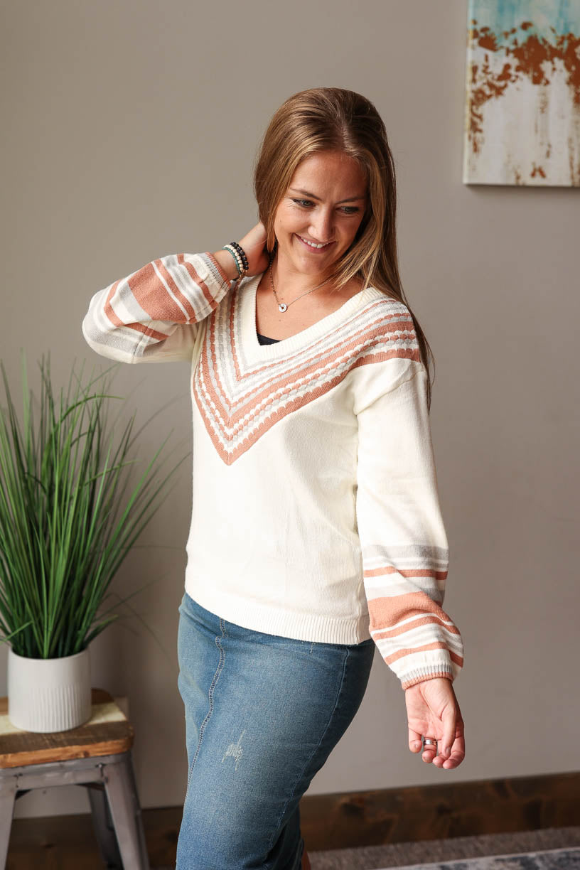 Stay cozy and chic in this beige V-Neck Contrast Sweater - perfect for the fall winter season! Featuring a subtle print detail and v-neck line, you'll love this chill yet stylish piece! Classy Closet Fall Fashion 