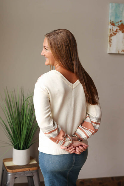 Stay cozy and chic in this beige V-Neck Contrast Sweater - perfect for the fall winter season! Featuring a subtle print detail and v-neck line, you'll love this chill yet stylish piece! Classy Closet Fall Fashion 