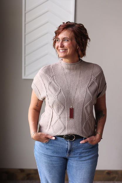 Stay comfortable and stylish from summer to fall to winter with our Smoke Grey High Neck Short Sleeve Sweater, featuring a soft, stretchy fabric and a textured design that works alone or layered.
