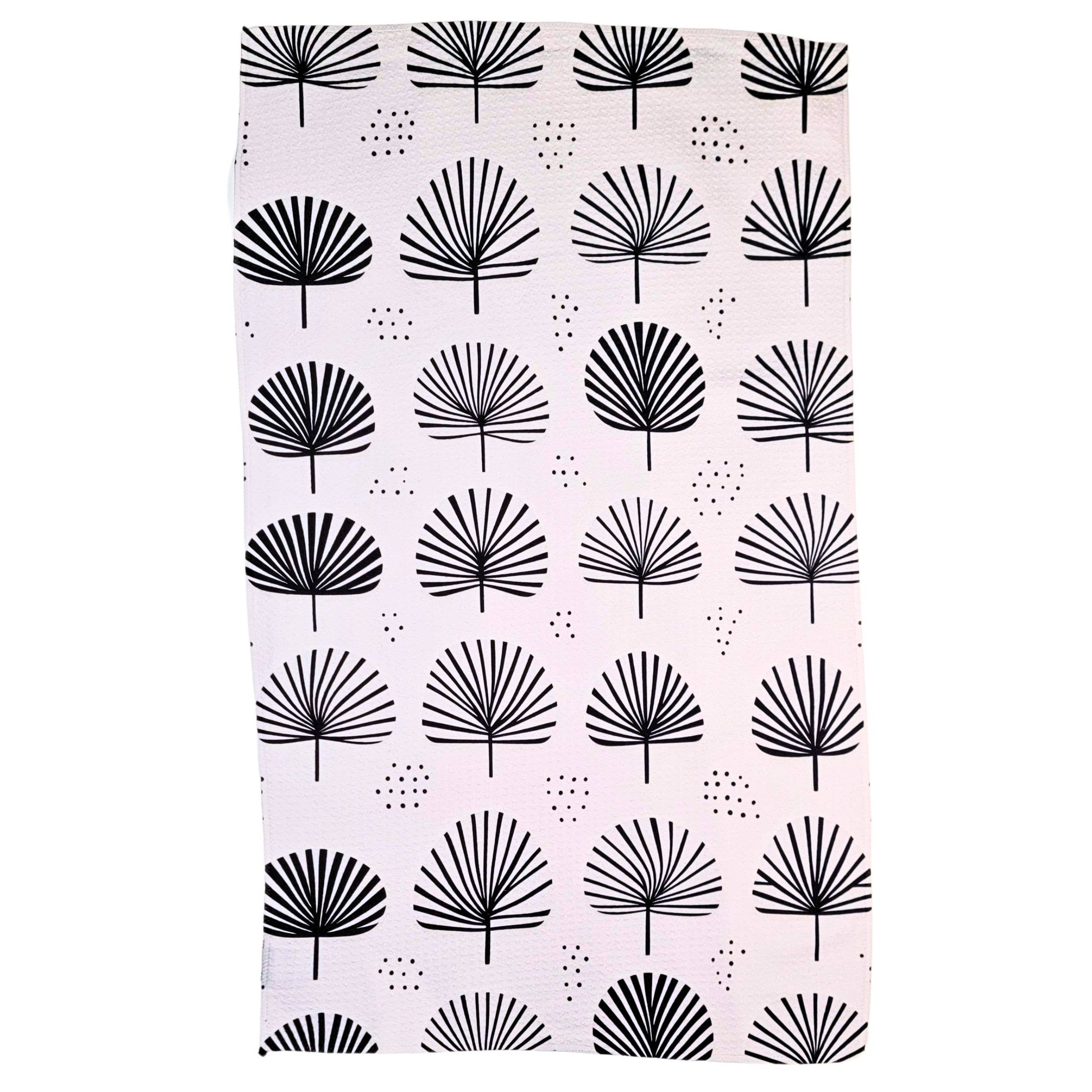 A rectangular white tea towel with a repeating black palm frond and dotted pattern, shown flat against a white background.