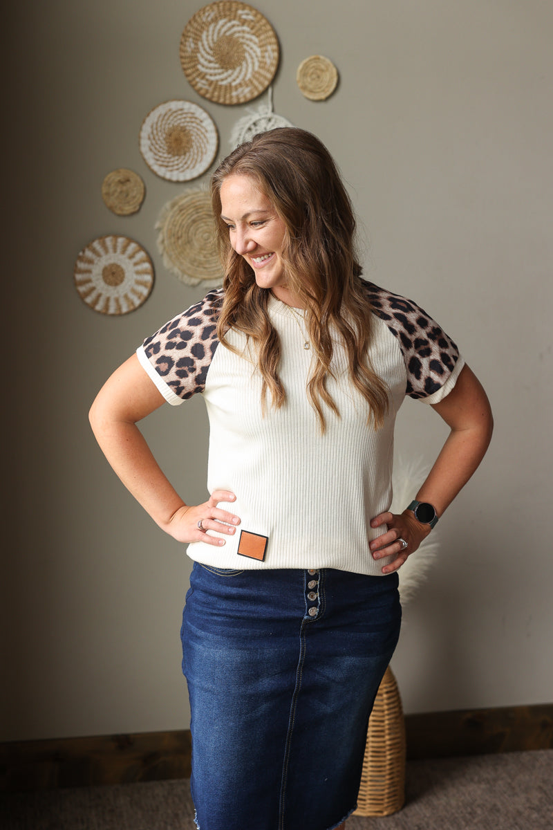 beige ribbed leopard contrast sleeve top with patchwork detail for summer outfits with button fly denim skirt