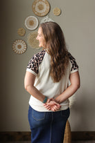 beige ribbed leopard contrast sleeve top with patchwork detail for summer outfits with button fly denim skirt