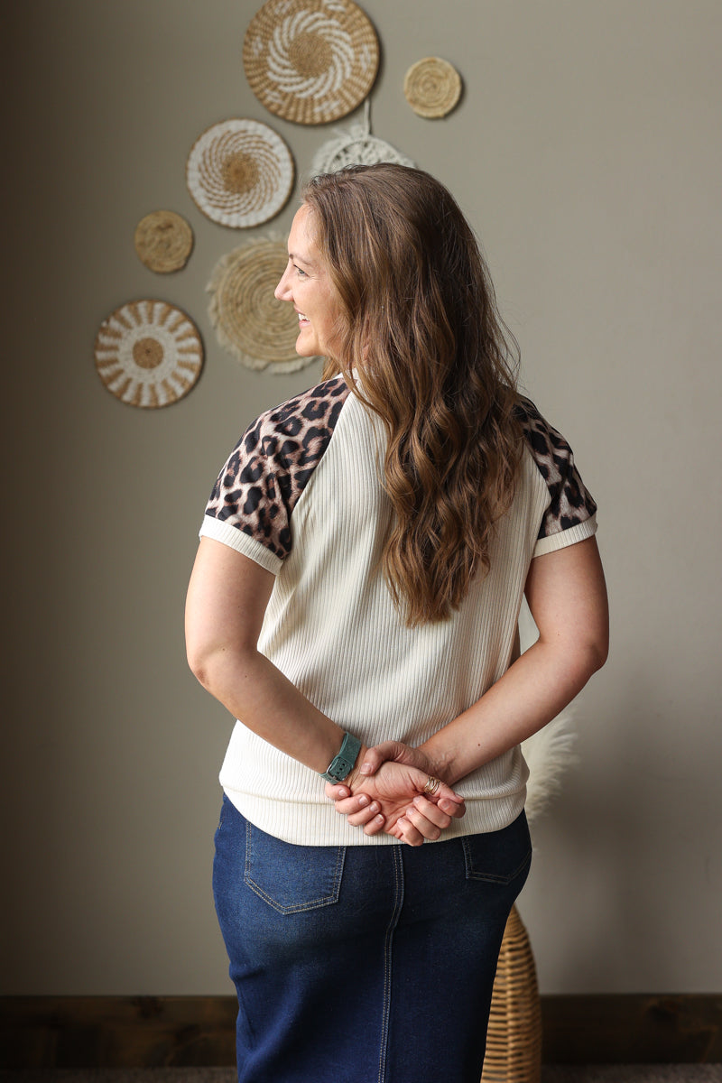 beige ribbed leopard contrast sleeve top with patchwork detail for summer outfits with button fly denim skirt