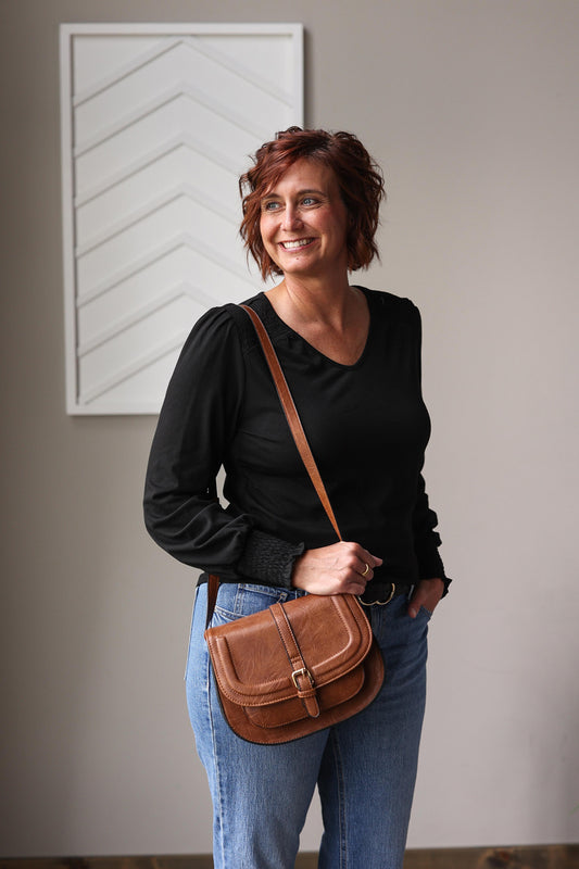 Black Shirred Shoulder and Sleeve Top is a budget-friendly essential perfect for versatile all-season styling, featuring a flattering V-neckline and feminine shirred shoulder and cuff details.