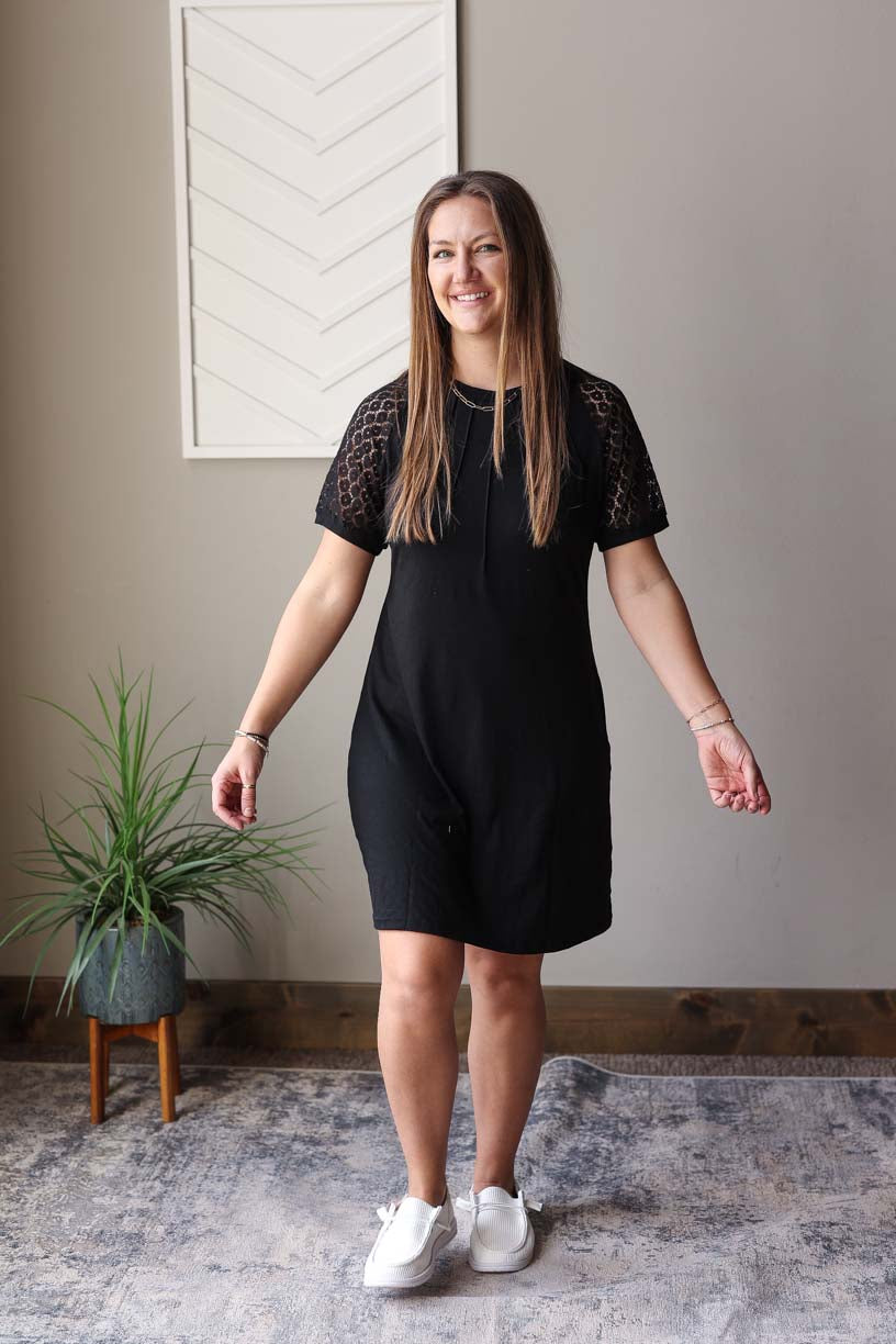Stay effortlessly chic and ready for any occasion with our Black Contrast Lace Raglon Sleeve Midi Dress. Perfect for running errands, hitting up the park, or grabbing a coffee with friends. The staple solid black design is versatile for wearing alone or layering up, and the chic lace sleeves add a touch of elegance to any outfit. So easy to throw on and head out the door. Enjoy a happy and simple summer with this dress.