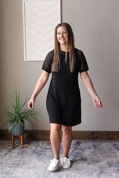 Stay effortlessly chic and ready for any occasion with our Black Contrast Lace Raglon Sleeve Midi Dress. Perfect for running errands, hitting up the park, or grabbing a coffee with friends. The staple solid black design is versatile for wearing alone or layering up, and the chic lace sleeves add a touch of elegance to any outfit. So easy to throw on and head out the door. Enjoy a happy and simple summer with this dress.