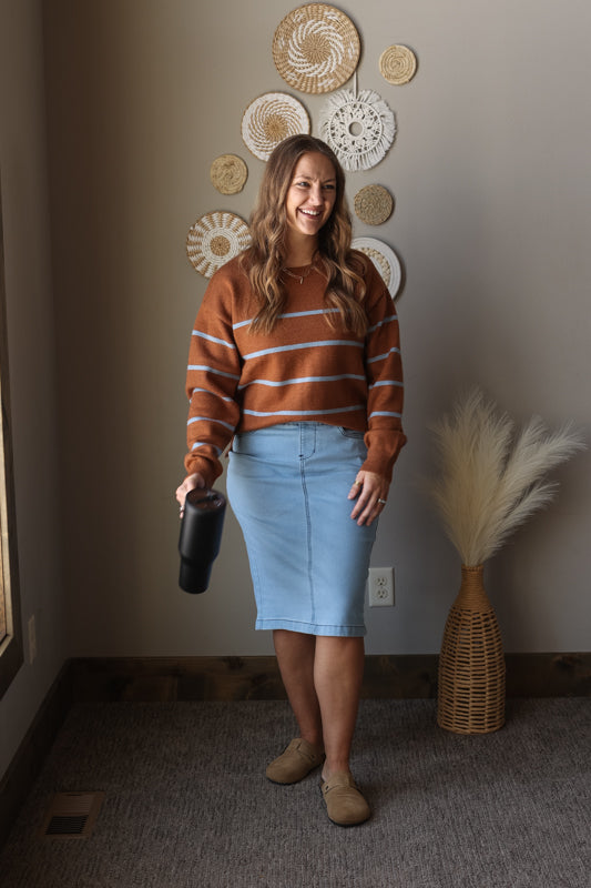Camel blue stripe crewneck sweater styled for a cozy modest winter outfit, perfect for casual mom everyday wear with a denim skirt