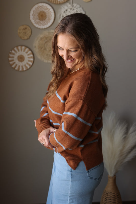 Camel blue stripe crewneck sweater styled for a cozy modest winter outfit, perfect for casual mom everyday wear. side angle photo showing side slit