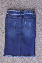 Back flat lay of a girls’ dark wash denim midi skirt showing patch pockets, a center seam, and a frayed hem.