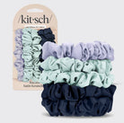 Set of scrunchies with packaging displaying 'kit-sch' brand on a light gray background