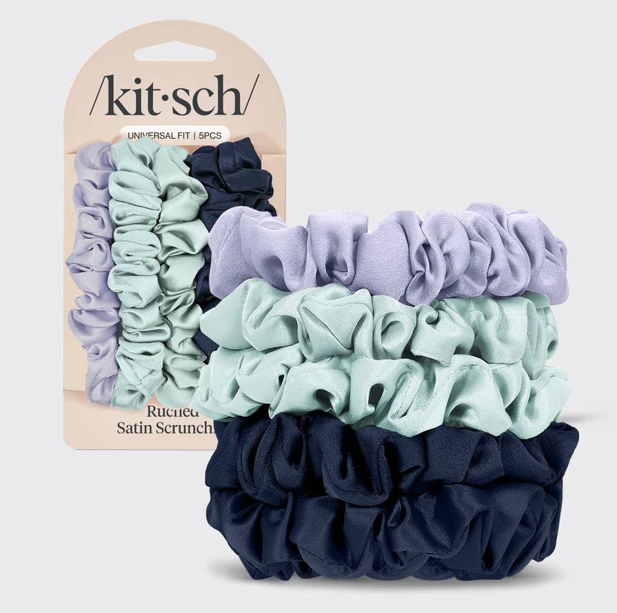 Set of scrunchies with packaging displaying 'kit-sch' brand on a light gray background