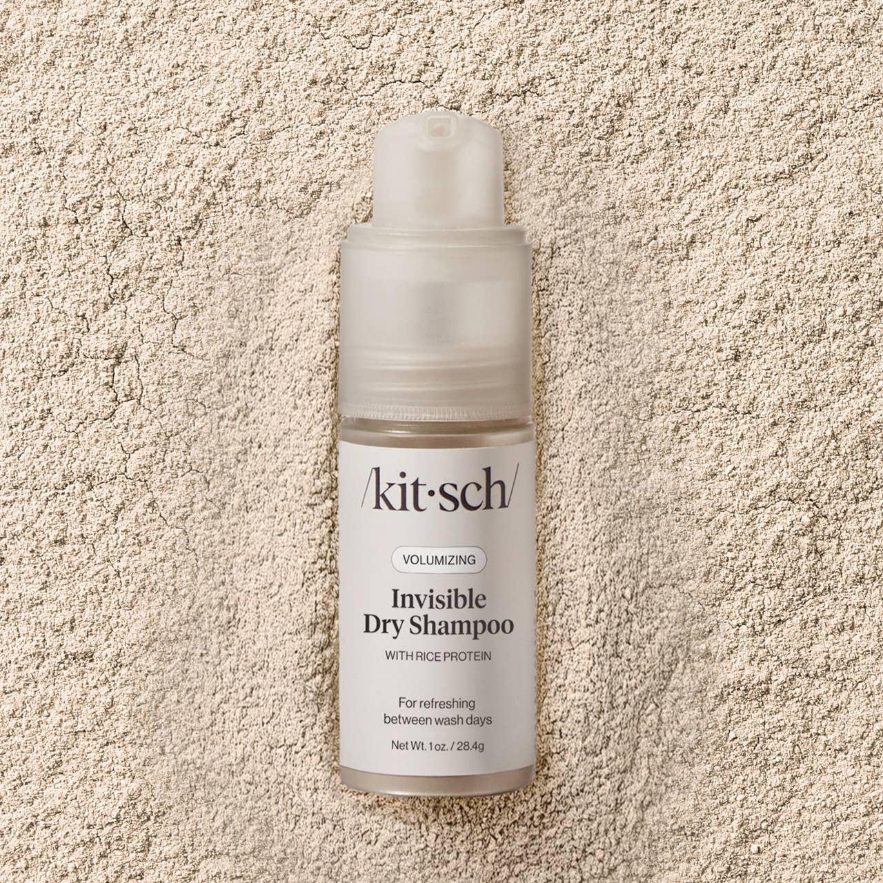 Kit-sch invisible dry shampoo bottle on a textured beige surface