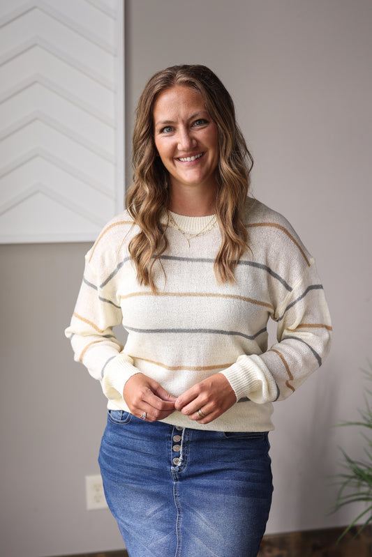 Modest multicolor striped fall sweater styled with denim skirt and ankle boots.