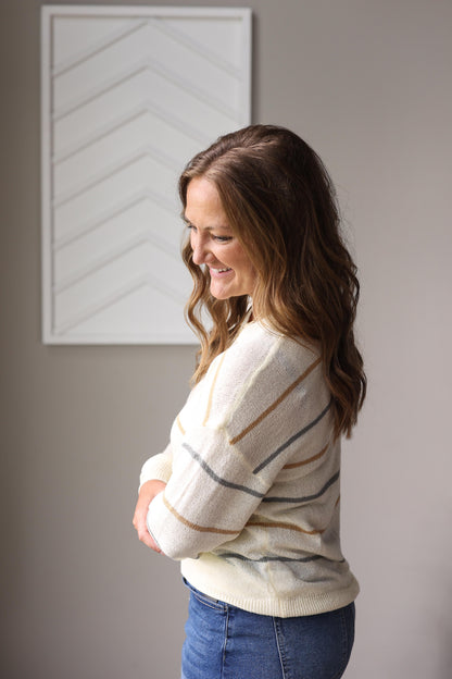 Modest multicolor striped fall sweater styled with denim skirt and ankle boots.