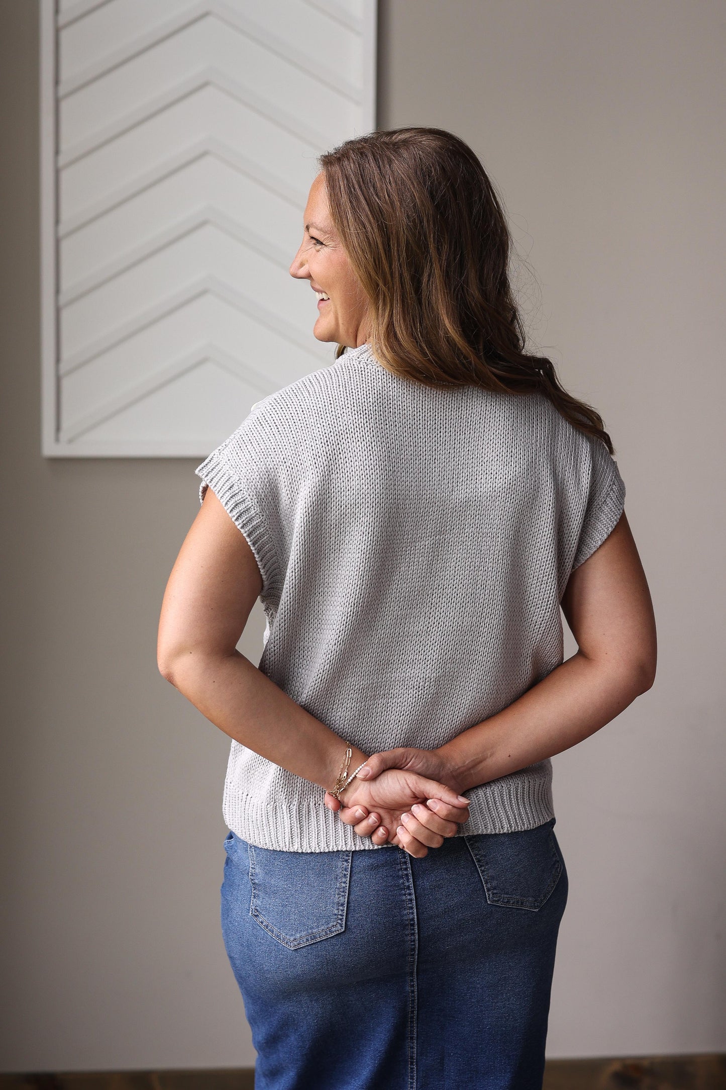 Grey sweater with front bow details styled with black pencil skirt for holiday church outfit at Classy Closet women's modest boutique.