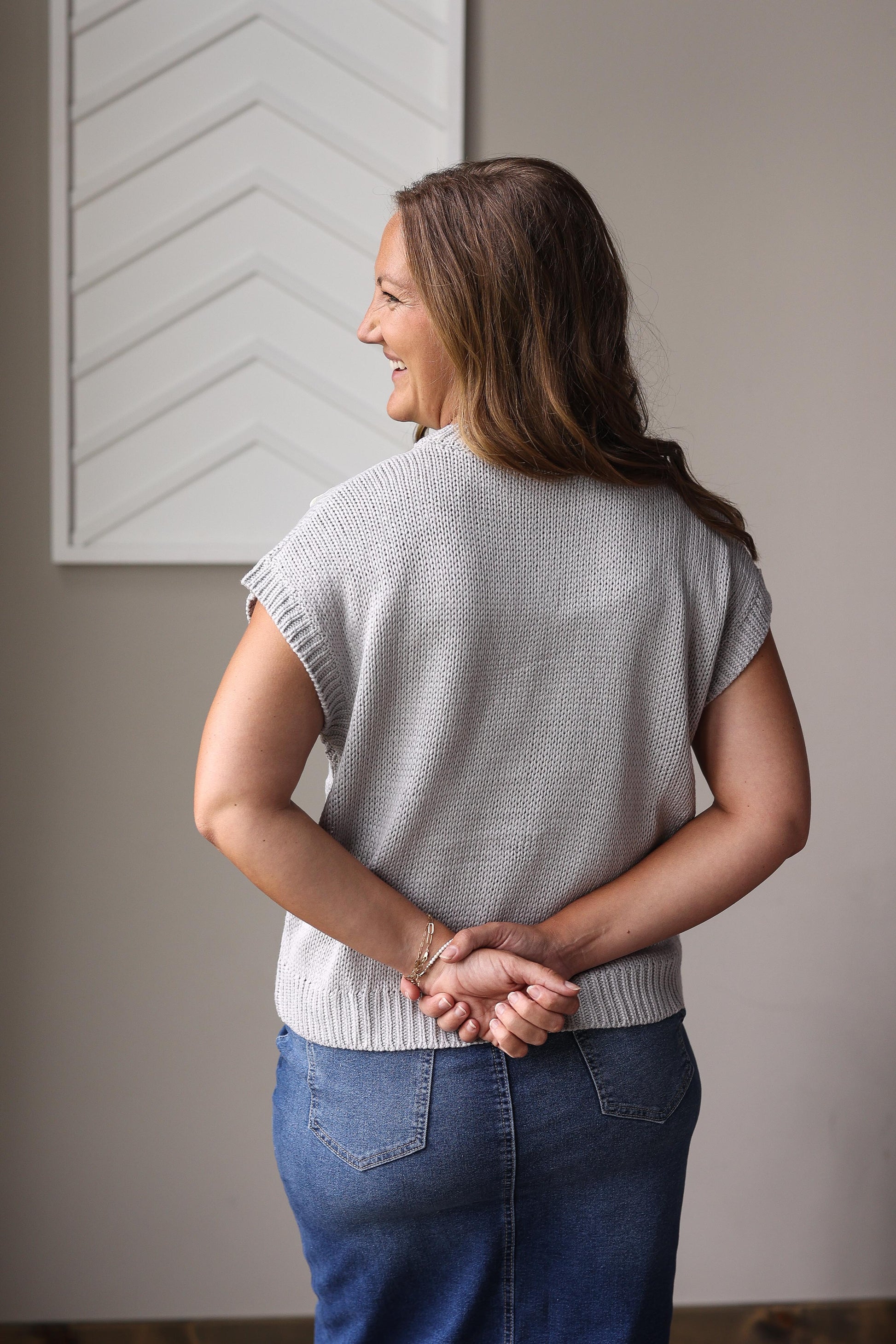 Grey sweater with front bow details styled with black pencil skirt for holiday church outfit at Classy Closet women's modest boutique.