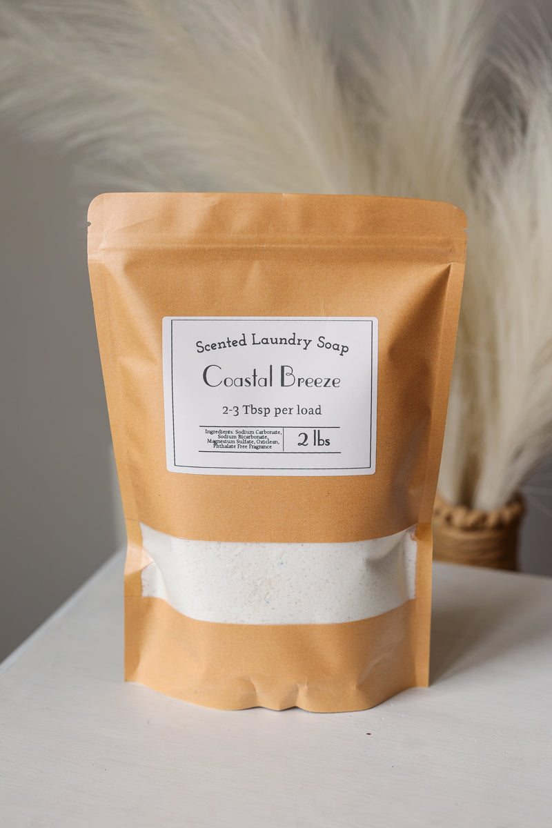 Scented laundry soap package labeled 'Coastal Breeze' on a neutral background