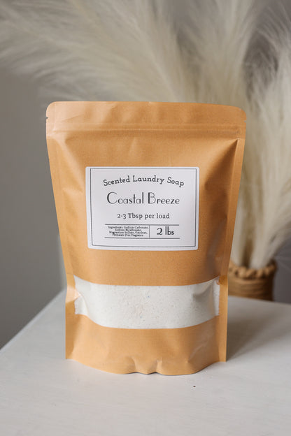 Scented laundry soap package labeled 'Coastal Breeze' on a neutral background