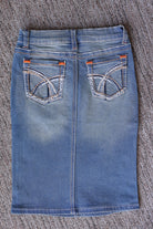 Back flat lay of a girls’ vintage wash denim midi skirt showing two patch pockets, contrast stitching, and a center seam.