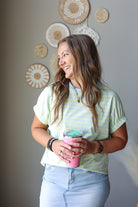 mint lime green and blue striped short sleeve top with light blue denim skirt