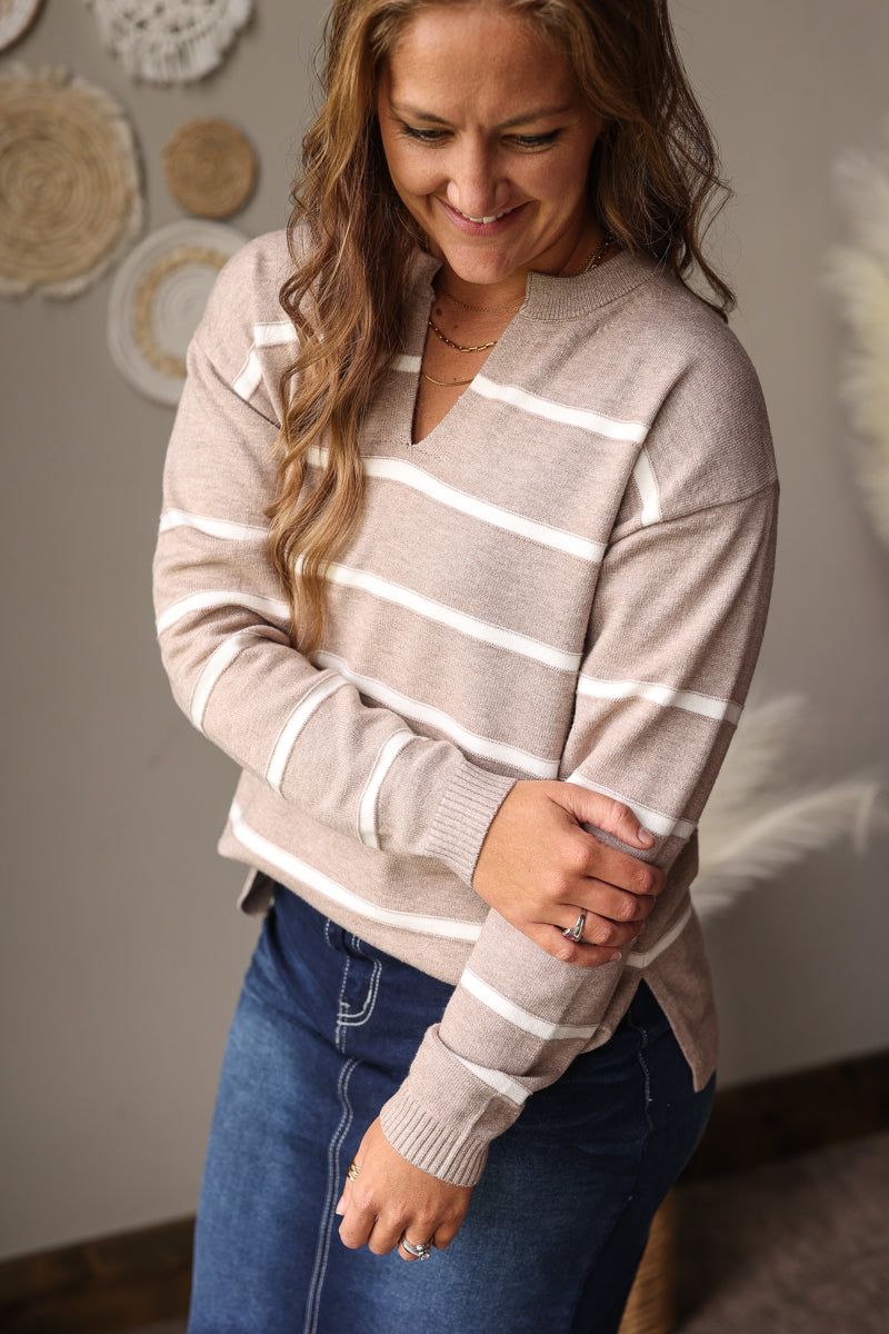 heathered mocha white striped vneck split neck long sleeve sweater with side slits styled with a dark wash stretch denim skirt