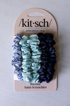 Pack of ruched satin scrunchies on a 'kitsch' branded card against a light gray background KITSCH satin hair ties