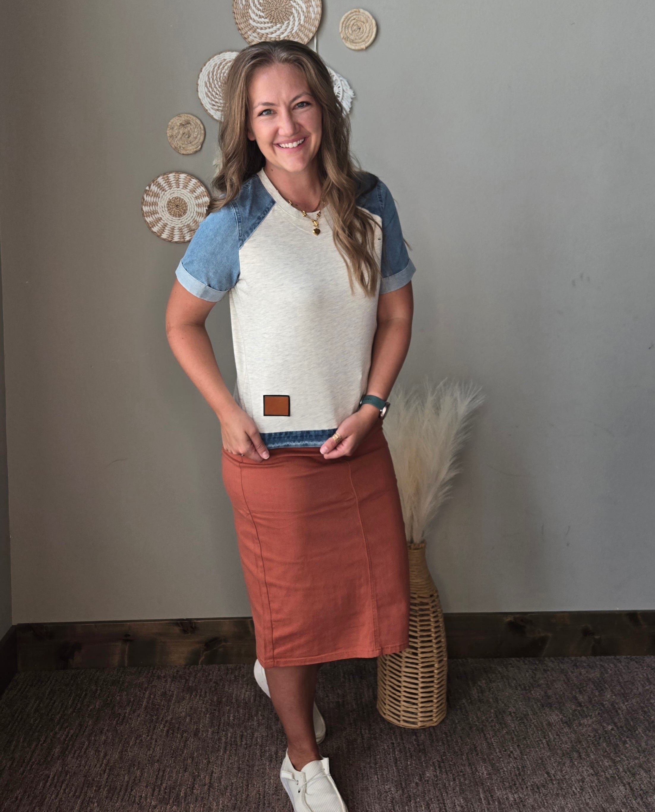 grey denim contrast short sleeve patchwork summer top with orange rust colored denim midi skirt showing the patchwork detail