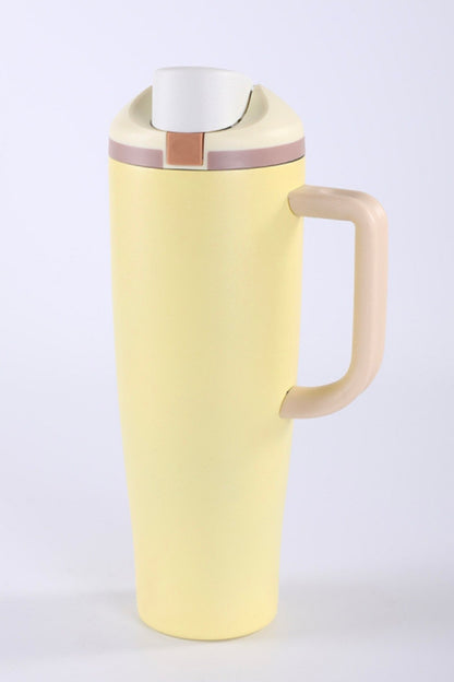 Yellow thermos with a handle on a white background owala dupe with handle flip spout and straw
