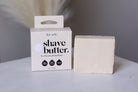 Kitsch shave butter packaging and bar on a neutral background
