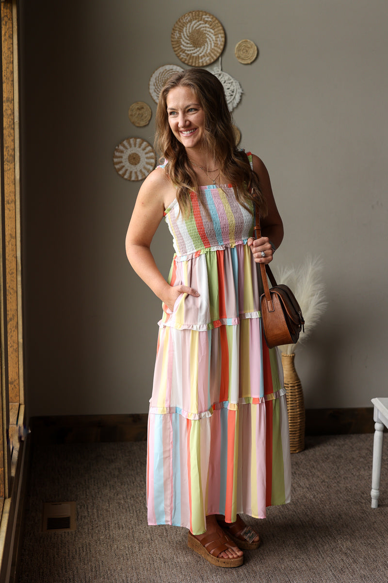coastal striped tiered maxi dress with pockets and smock chest with brown purse