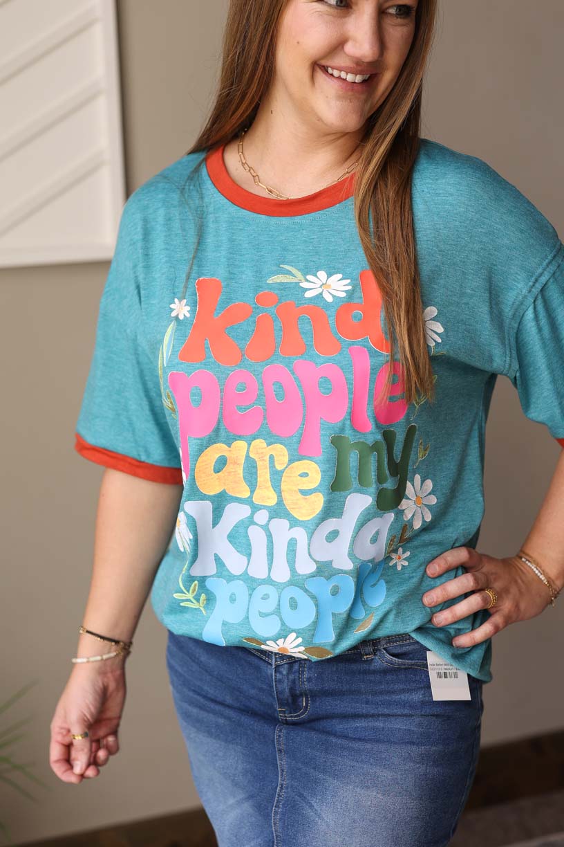 Spread kindness with our Lagoon Blue "Kind People Are My Kind Of People" Tee. The fun lagoon blue color and coral orange neck &amp; sleeve trim add a pop of color to this oversized graphic tee. Remember to be kind in this comfortable oversized fit, available in sizes S-3XL PLUS.