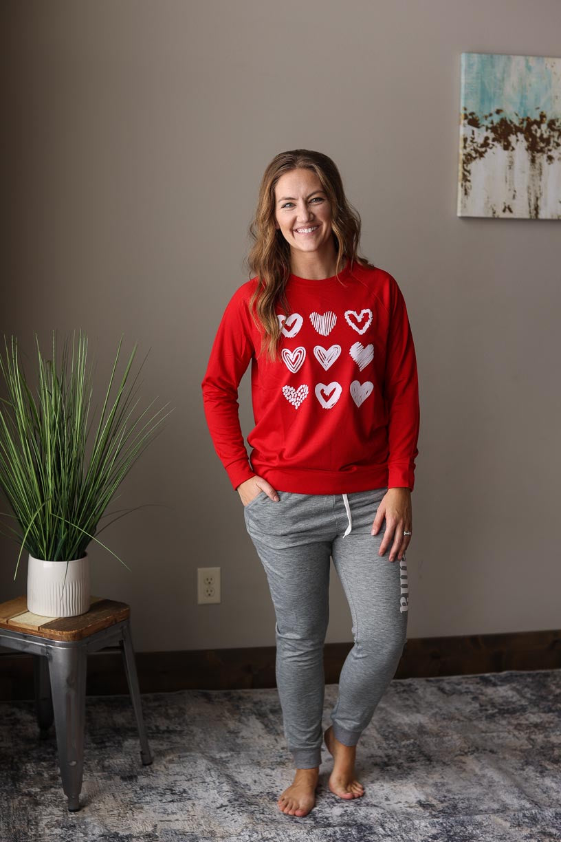 Red Hearts Print Crew Sweatshirt for Valentine's Day, Heart Graphic Casual Top at Classy Closet Boutique Near Me